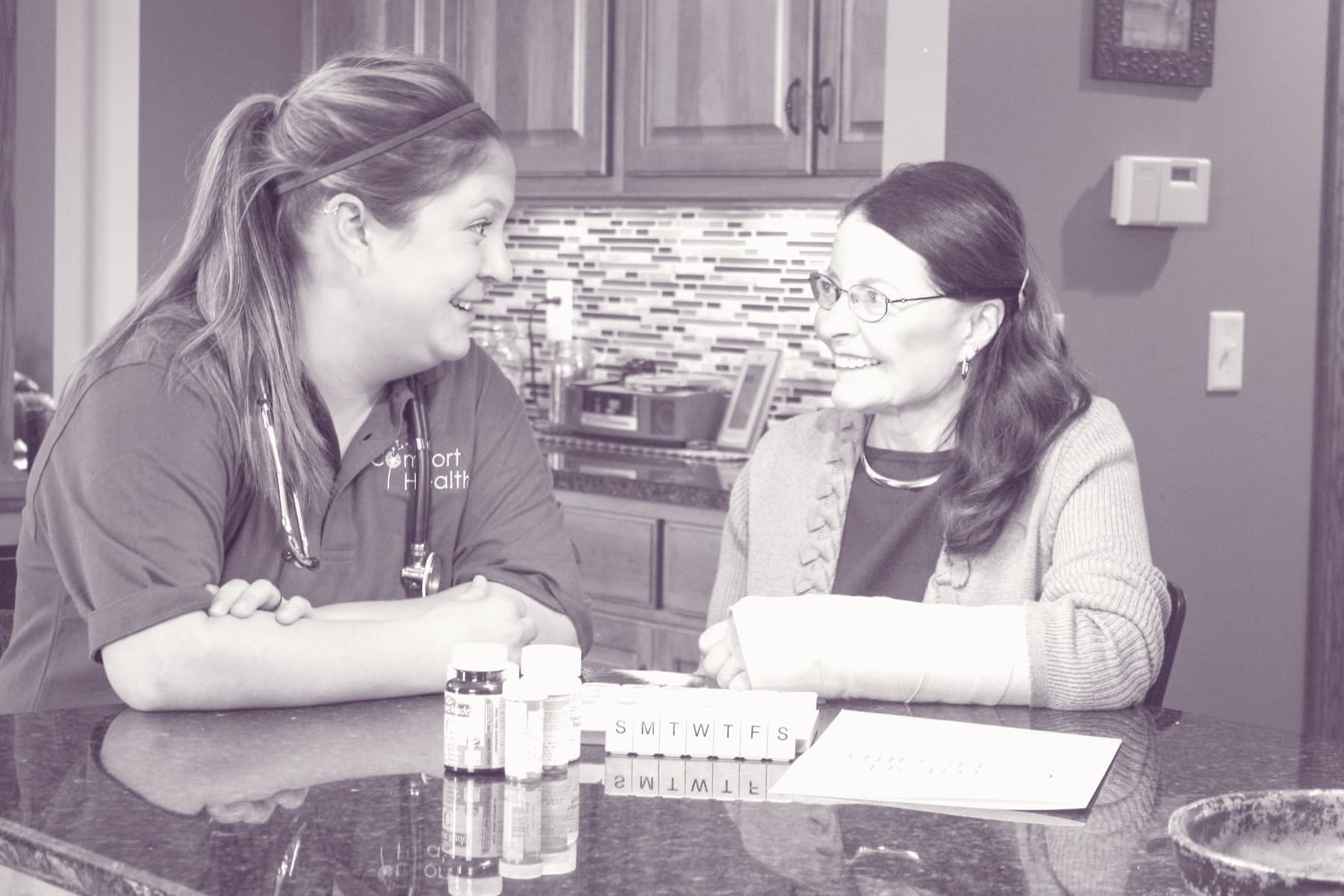 A Comfort Health therapist talking through a wrist brace fit with a Rochester client.