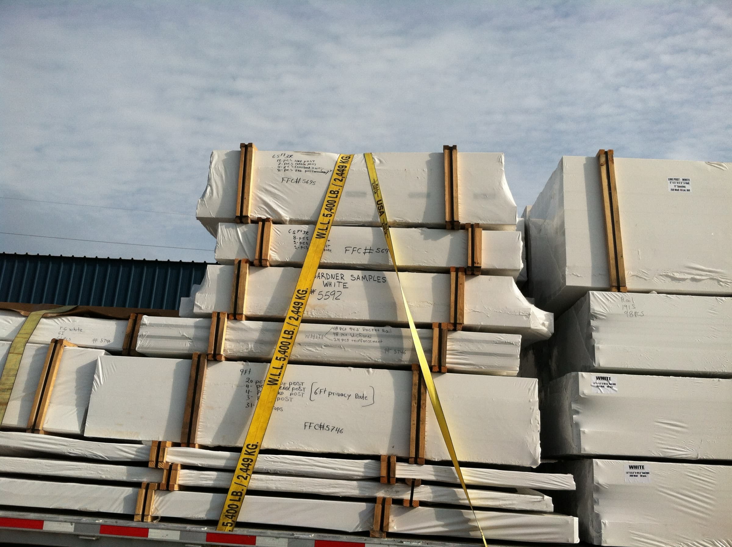 Gardner Fence panels strapped on a freight pallet, ready to ship from the Bemidji yard.