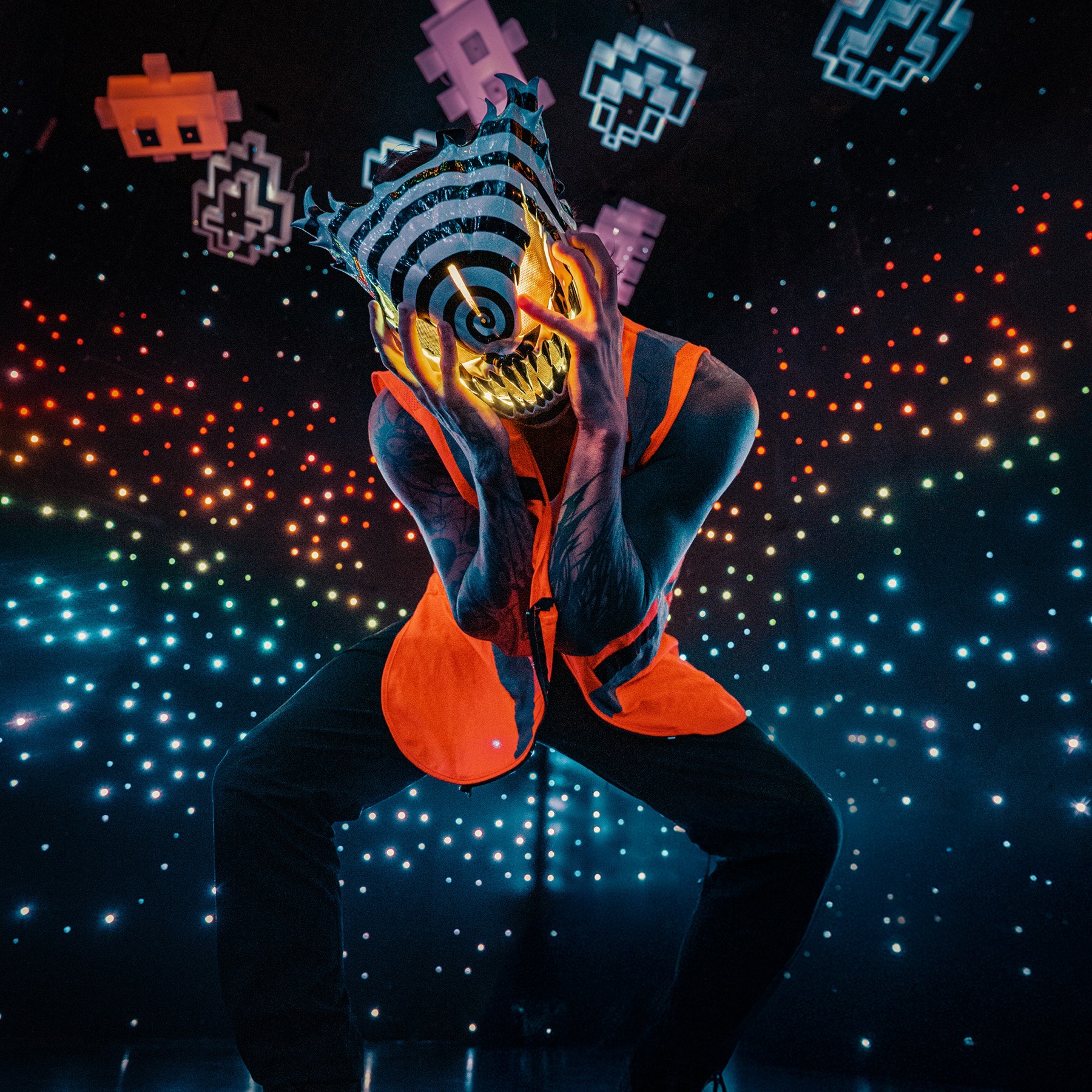 Performer portrait against a starfield of neon