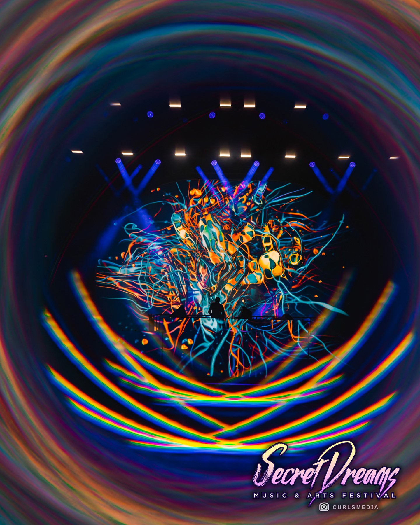 Teal laser vortex projected on stage